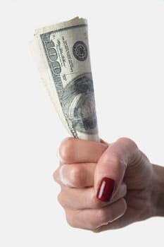 Close-up of a womanŽs hand holding one hundred dollar bills