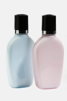 Close-up of two moisturizer bottles