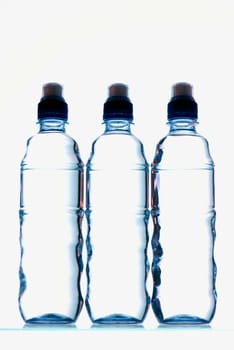 Close-up of three water bottles