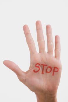 Text STOP written on a personŽs palm