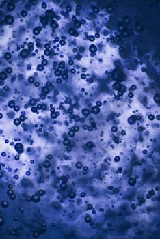 Close_up of water droplets on a blue background