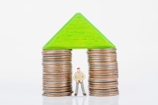 Figurine between two stacks of coins