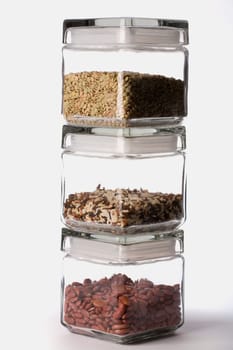 Close-up of beans and spice in different jars