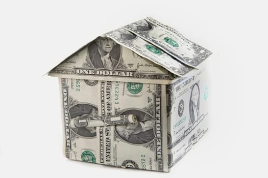 Close-up of the model of a house made of American dollar bills