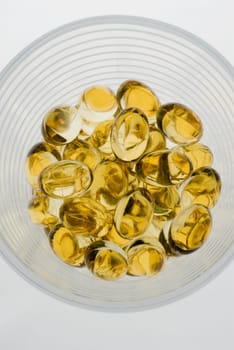 Close_up of capsules in a glass bowl