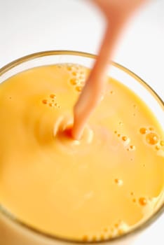 Close-up of juice being poured into a glass
