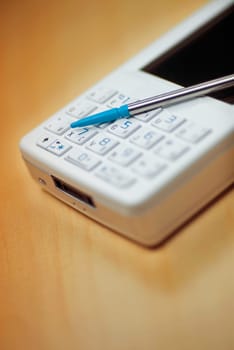Close_up of a personal data assistant with a stylus