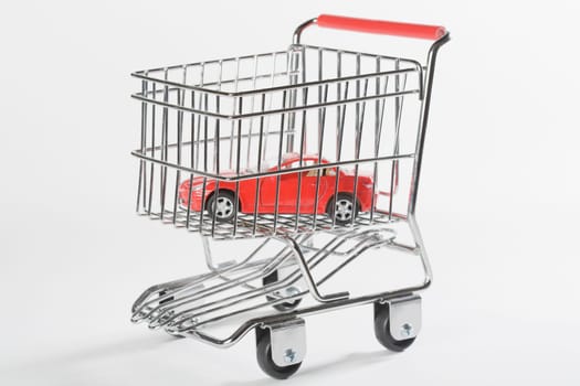 Close_up of a toy car in a shopping cart