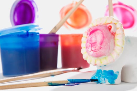 Close-up of brushes with watercolor paints