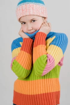 Portrait of a girl standing with holding her sweater