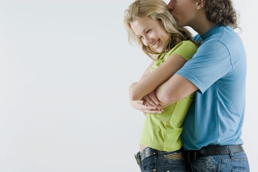 Side profile of a young couple romancing
