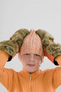 Portrait of a boy with his hands on his head
