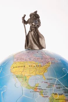 Close_up of a figurine of a fortune teller on a globe