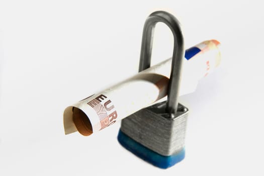 Close-up of a combination lock and Euro dollars