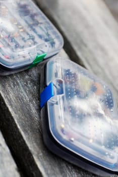 Close-up of two fly boxes