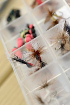 Close-up of fishing lures in a box