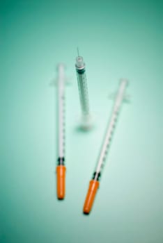 Close_up of three syringes