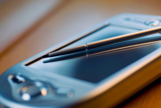 Close_up of a personal data assistant and a stylus