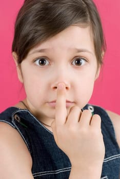 Portrait of a girl touching her nose