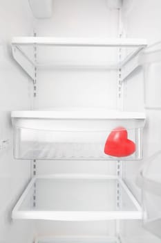Heart shaped balloon in a refrigerator