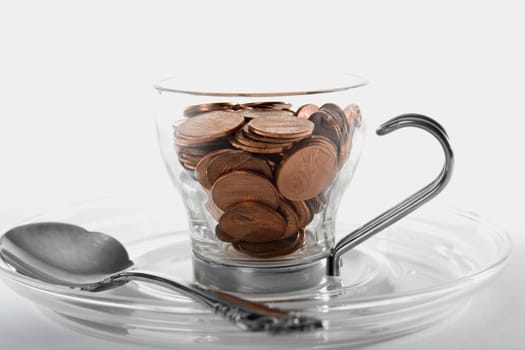 Close-up of copper coins in a cup