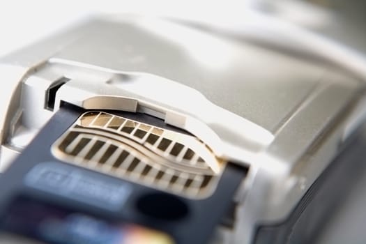 Close-up of a mobile phone and a memory card
