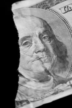 Close-up of a torn bank note