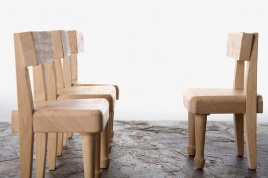 Close-up of four wooden chairs