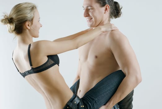 Close_up of a young couple smiling and romancing