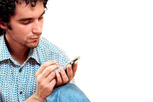 Close-up of a young man operating a personal data assistant