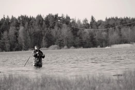 Mature man fishing in the river