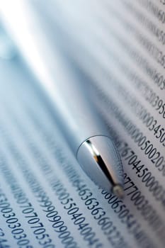 Close-up of a pen on a financial page