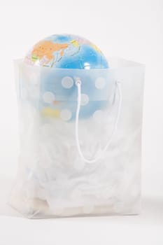 Globe in a transparent shopping bag