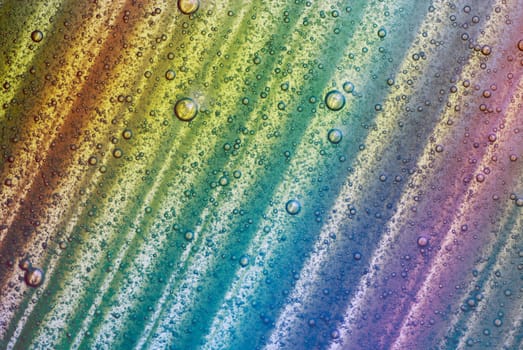 Water drops on a colored surface