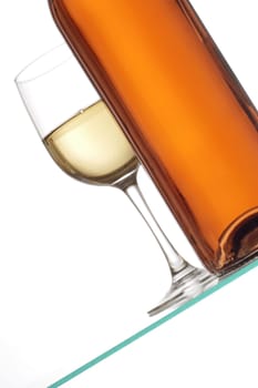 Close-up of a glass of wine with a wine bottle