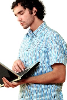 Side profile of a young man using a laptop