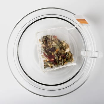 High angle view of a herbal teabag in a cup