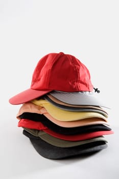 Close-up of a stack of baseball caps