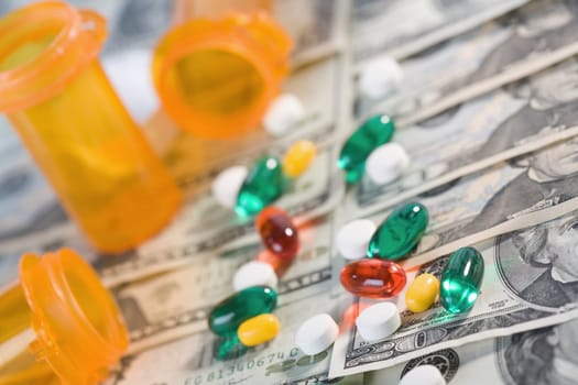 Close_up of medicines and pill bottles on US paper currency