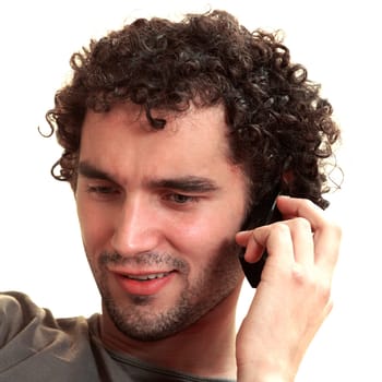 Close-up of a young man talking on a mobile phone