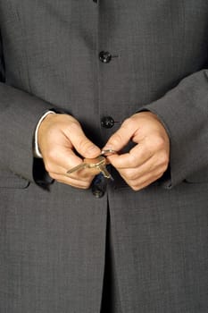 Mid section view of a businessman holding keys