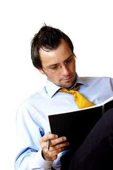 Businessman reading a notebook