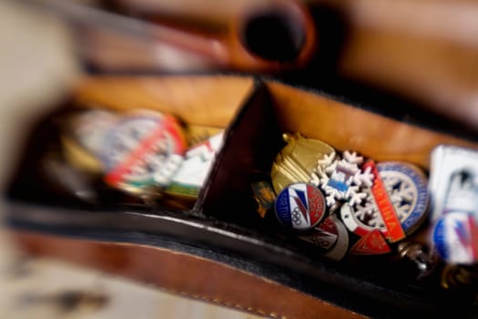 Close-up of badges with coat of arms