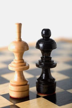 Close-up of a Bishop and a Queen on a chessboard