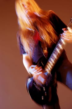 Close-up of a musician playing the electric guitar