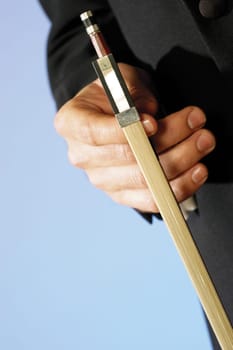 Close-up of a musicianŽs hand holding the bow of a violin