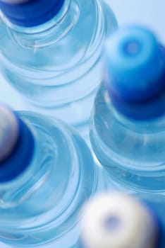 Close-up of four water bottles