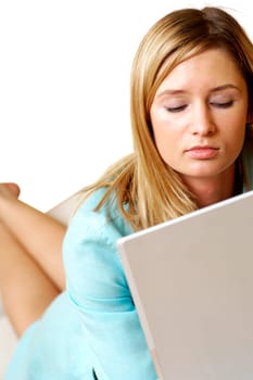 Businesswoman lying in front of a laptop