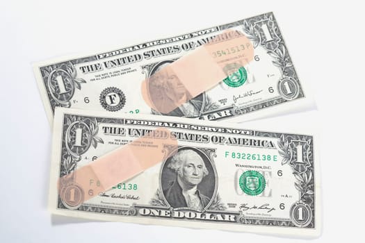 Adhesive tapes on US dollar bills