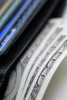 Close-up of one hundred dollar bills in a wallet